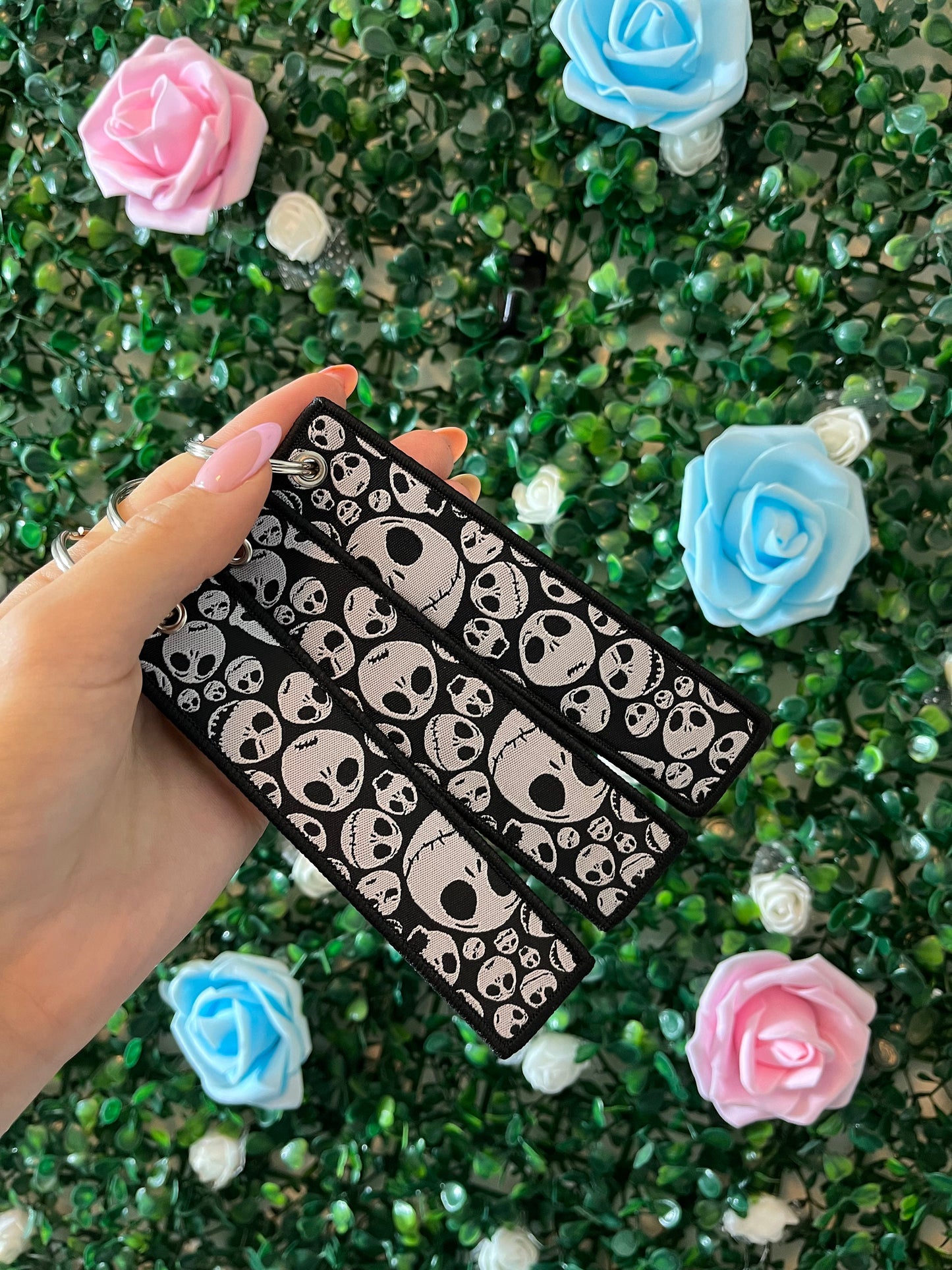 Double sided keyrings black and white skeleton.