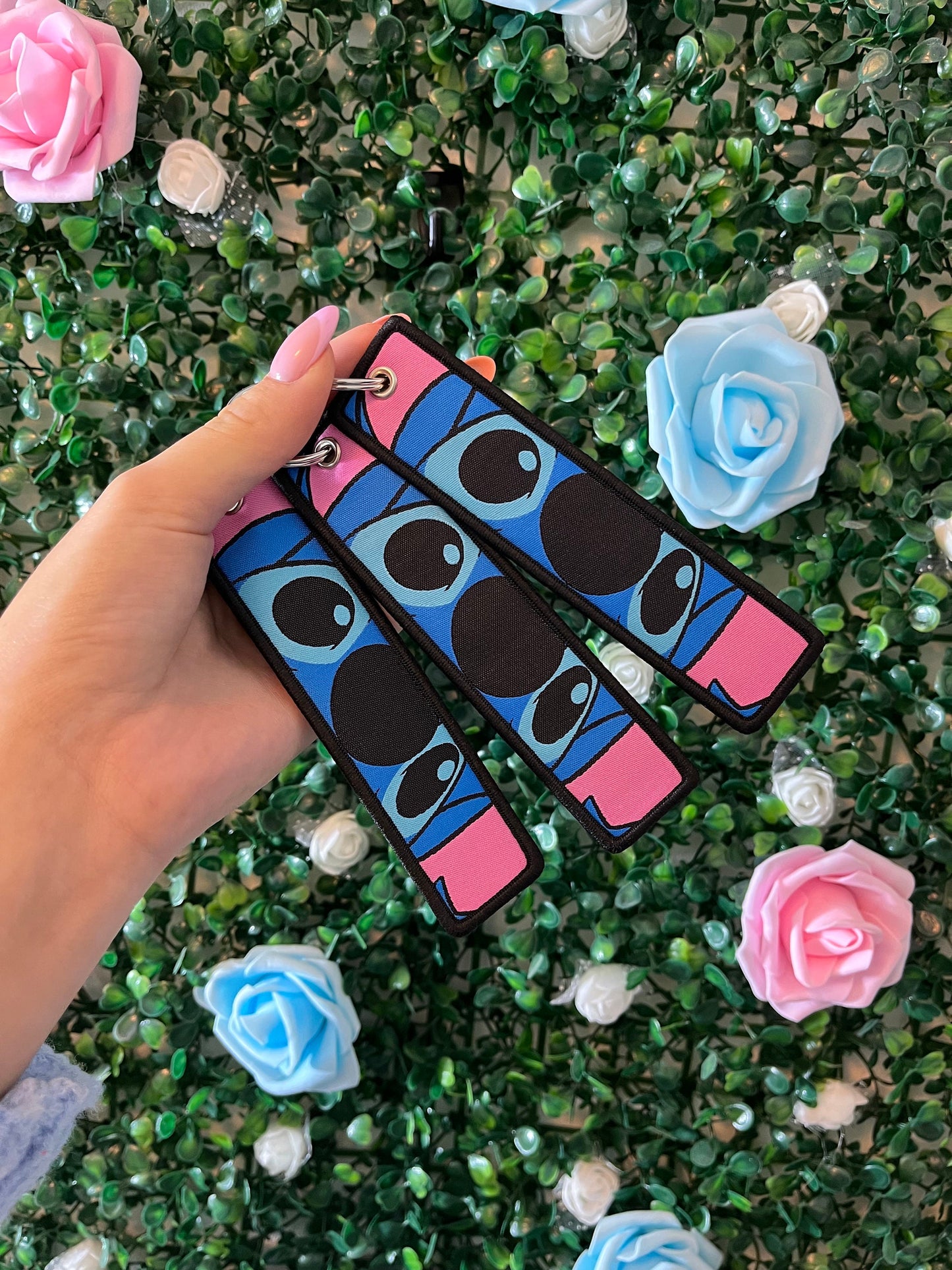 Double sided keyrings blue and pink.