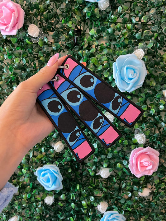 Double sided keyrings blue and pink.
