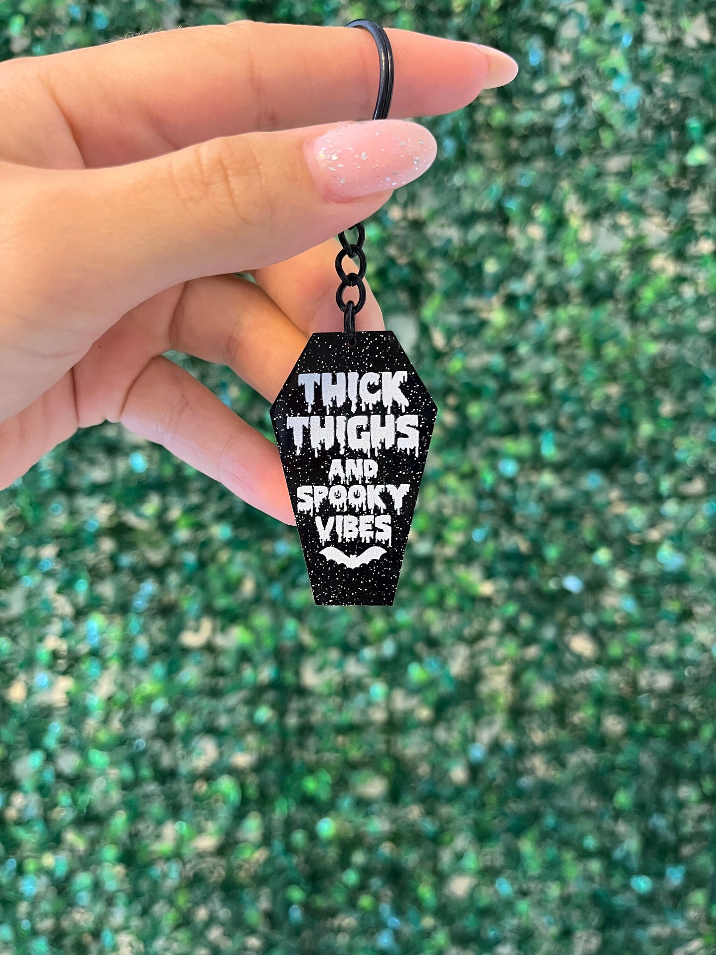 Black and white glittery ‘thick thighs and spooky vibes’ Halloween keyring keychain car keys.